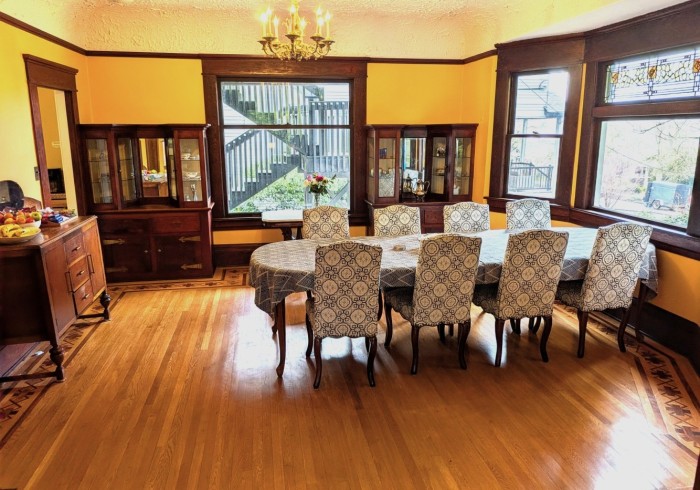 a dining room with a table and chairs